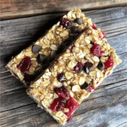 - 1 cup dried cherries, chopped - 1 cup almonds, roughly chopped - 1 cup rolled oats - 1/2 cup almond butter - 1/4 cup honey or maple syrup - 1/4 teaspoon salt - 1/2 teaspoon almond extract For these cherry almond energy bars, the main ingredients bring great taste and energy. 1. Dried cherries add natural sweetness and a chewy texture. They pack antioxidants and vitamins. 2. Almonds give a nice crunch and healthy fats. They also provide protein and fiber. 3. Rolled oats are the base of the bars. They offer whole grains and help you feel full. 4. Almond butter binds everything together. It adds creaminess and rich flavor. 5. Honey or maple syrup serves as a natural sweetener. It adds moisture and keeps the bars from being dry. 6. Salt enhances all the flavors well. It balances the sweetness of the other ingredients. 7. Almond extract boosts the almond flavor. Just a little adds a nice touch. - 1/4 cup sunflower seeds - 1/4 cup mini dark chocolate chips You can change up the bars with some optional ingredients. 1. Sunflower seeds add more crunch and nutrition. They are rich in vitamins and minerals. 2. Mini dark chocolate chips give a sweet touch. They add a fun taste and make the bars feel like a treat. - Caloric content: Each bar has about 150 calories. This makes them a good snack. - Protein, fibers, and sugars: You will get around 4 grams of protein, 3 grams of fiber, and 7 grams of sugar in each bar. - Vitamins and minerals: The bars offer vitamin E, magnesium, and iron. These nutrients help keep you healthy. These cherry almond energy bars are not just tasty but also a smart choice for snacking. 1. Preheat your oven. Set it to 350°F (175°C). This step warms the oven for even baking. 2. Prepare the baking dish. Take an 8x8 inch dish and line it with parchment paper. Leave some paper hanging over the edges. This will help you remove the bars later. 1. Combine the dry ingredients. In a large bowl, mix together: - 1 cup dried cherries, chopped - 1 cup almonds, roughly chopped - 1 cup rolled oats - 1/4 cup sunflower seeds (optional) Stir well to blend everything evenly. 2. Melt the wet ingredients. In a small saucepan, add: - 1/2 cup almond butter - 1/4 cup honey or maple syrup - 1/4 teaspoon salt - 1/2 teaspoon almond extract Heat over low. Stir until melted and smooth, about 2-3 minutes. 1. Transfer the mixture to the baking dish. Pour the warm almond butter mixture over the dry ingredients. If using, fold in 1/4 cup mini dark chocolate chips at this point. 2. Mix thoroughly. Use a spatula or your hands to combine. Ensure all the dry ingredients are coated well. 3. Press the mixture into the dish. Firmly press it down into an even layer. This helps the bars hold their shape. 4. Bake the bars. Place the dish in your preheated oven. Bake for 20-25 minutes. Check for doneness when the edges start to turn golden brown. To get the best texture for your Cherry Almond Energy Bars, compact the mixture well. When you press it down firmly, the bars hold together better. If you want a softer bar, reduce the baking time by a few minutes. Check them at 20 minutes. If the edges are golden, they are done! Feel free to swap nuts or sweeteners based on what you like. Pecans or walnuts can work well instead of almonds. If you want a vegan option, use maple syrup instead of honey. This change keeps the bars sweet while fitting a plant-based diet. To boost the almond flavor, add a bit more almond extract. A teaspoon can make a big difference. You can also add spices like cinnamon or nutmeg for extra warmth. These flavors give the bars a unique twist that keeps things interesting! {{image_2}} You can mix things up with different dried fruits. Try raisins, apricots, or cranberries. Each fruit adds its own taste and texture. You can also use other nuts. Pecans, walnuts, or cashews work great. Each nut gives a unique crunch and flavor. If you need gluten-free options, use gluten-free oats. This keeps the bars safe for those with gluten issues. For nut-free versions, you can use seeds. Sunflower or pumpkin seeds can replace nuts. They still give a nice texture and nutrients. You can make bite-sized bars for on-the-go snacks. Just cut the bars smaller after baking. If you want larger batches, double the recipe. This way, you have plenty for everyone. Share them with family and friends, or keep them for yourself! To keep your Cherry Almond Energy Bars fresh, use an airtight container. This helps prevent air and moisture from getting in. Store them at room temperature for up to a week. If you keep them in a cool, dry place, they will taste their best. Refrigerating your energy bars adds freshness and keeps them longer. When stored in the fridge, they can last up to two weeks. This method also helps maintain their chewy texture and flavor. You can freeze the bars for even longer storage. Wrap them tightly in plastic wrap, then place them in a freezer bag. This prevents freezer burn. When you want to eat one, take it out and let it thaw at room temperature. You can also microwave it for a few seconds. Enjoy your delicious treat whenever you want! No, fresh cherries won’t work as well. Dried cherries have less moisture. They add sweetness and chewy texture to the bars. You want to keep the right balance. Dried fruit holds together better in energy bars. These bars last up to one week at room temperature. Store them in an airtight container. For longer freshness, refrigerate them. In the fridge, they can last up to two weeks. Yes, these energy bars are great for kids. They are tasty and packed with nutrients. Kids love the sweet cherries and crunchy almonds. They make a healthy snack for school or play. Yes, you can add protein powder! Mix in one or two scoops. Just be sure to adjust the wet ingredients slightly. This will keep the bars moist and tasty. You can buy Cherry Almond Energy Bars at many grocery stores. Look in the snack aisle or health food section. You can also find them online. If you want a fresh batch, try making them at home! In this blog post, we explored the key ingredients needed for Cherry Almond Energy Bars. We discussed step-by-step instructions to help you make them easily. I shared tips for texture and flavor variations, plus storage methods to keep them fresh. Now, you have the tools to create a delicious snack. Enjoy these bars anytime for energy and taste. Try new flavors and find what you love best!