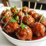 To make Slow Cooker Sweet and Spicy BBQ Meatballs, gather these items: - 1 pound ground beef (or turkey for a lighter option) - 1/2 cup breadcrumbs - 1/4 cup grated Parmesan cheese - 1 large egg - 2 cloves garlic, minced - 1 teaspoon onion powder - 1 teaspoon salt - 1/2 teaspoon black pepper - 1/2 teaspoon crushed red pepper flakes (adjust for spice preference) - 1 cup BBQ sauce (your choice of sweet or spicy) - 1 tablespoon honey - 1 tablespoon apple cider vinegar - 1 teaspoon smoked paprika - 1/4 cup chopped fresh parsley for garnish You can swap some ingredients if needed. Use ground turkey instead of beef. Instead of breadcrumbs, try crushed crackers. If you don't have Parmesan, any hard cheese works well too. You can even leave out the egg if you want a lighter meatball. To change the taste, add more honey for sweetness. If you want more heat, increase the crushed red pepper flakes. For a milder sauce, choose a sweet BBQ sauce. If you like it spicier, use a hot sauce or a spicy BBQ sauce. Remember, you can always taste and adjust as you cook! To start, grab a large mixing bowl. You will need to add 1 pound of ground beef or turkey. Next, mix in 1/2 cup of breadcrumbs and 1/4 cup of grated Parmesan cheese. Then, crack in 1 large egg. Now, add 2 cloves of minced garlic, 1 teaspoon of onion powder, 1 teaspoon of salt, 1/2 teaspoon of black pepper, and 1/2 teaspoon of crushed red pepper flakes. Mix all these ingredients well. Be careful not to overmix. A gentle touch keeps the meatballs tender. Once your mixture is ready, it’s time to shape the meatballs. Take a small amount of the mixture and roll it into a ball about 1 inch wide. Place each meatball on a baking sheet. You can fit about 20 meatballs on one sheet. Make sure to leave some space between them so they do not stick together. Now it’s time to cook! In a separate bowl, mix 1 cup of BBQ sauce with 1 tablespoon of honey, 1 tablespoon of apple cider vinegar, and 1 teaspoon of smoked paprika. Stir until everything blends well. Take your baking sheet of meatballs and place them in the slow cooker in a single layer. Pour the BBQ sauce mixture over the meatballs. Make sure they are well coated. Cover the slow cooker and set it to cook on low for 4 hours or high for 2 hours. When they are done, gently stir the meatballs to coat them in the sauce. For a nice finish, garnish with 1/4 cup of chopped fresh parsley before serving. Enjoy your sweet and spicy BBQ meatballs! To make great meatballs, you want the right mix. Use equal parts meat and breadcrumbs. For this recipe, one pound of meat works well. Adding Parmesan cheese gives the meatballs a nice flavor. Mix the ingredients just until blended. Overmixing can lead to tough meatballs. Make them about one inch wide for even cooking. Slow cooking is all about patience. Start by placing the meatballs in a single layer. This helps them cook evenly. Pour the BBQ sauce over them to keep them moist. Cover the slow cooker tightly. This keeps the heat in and helps the meatballs cook through. Cooking on low is ideal for about four hours. If you're in a hurry, high for two hours works too. Serve these meatballs hot from the slow cooker. They look great on a wide dish topped with extra BBQ sauce. Add fresh parsley for color. Offer toothpicks for easy eating. Pair these with coleslaw or a fresh salad. For a fun twist, serve them in slider buns. They make a great snack for a party or game day. {{image_2}} For a kick, add more spice to your meatballs. You can mix in chopped jalapeños or a dash of hot sauce. These additions will give your meatballs more heat and flavor. You can also try adding cayenne pepper for an extra punch. Remember to taste as you go, so you find the right balance for your taste buds. If you want a lighter meal, ground turkey works great. It keeps the meatballs moist and tasty while cutting down on fat. You can also make meatballs with lentils or quinoa. These plant-based options are healthy and full of flavor. Just cook the lentils or quinoa before mixing them in. Switch up your BBQ sauce for different flavors. You might enjoy using teriyaki sauce or sweet chili sauce. These options add unique tastes that pair well with the meatballs. If you like tang, try a mustard-based sauce. Each sauce brings its own twist to the dish and makes it exciting. To store your leftover sweet and spicy BBQ meatballs, let them cool first. Place them in an airtight container. This keeps them fresh for up to three days in the fridge. If you want to enjoy them later, make sure to seal the container tightly. When you are ready to eat your leftover meatballs, you can reheat them easily. The best way is to use the microwave. Place the meatballs in a safe dish and cover them with a lid or a damp paper towel. Heat them in 30-second intervals until they are hot. You can also reheat them on the stove. Just add a little BBQ sauce in a pan and warm them gently over low heat. Freezing meatballs is a great way to save them for another meal. First, let the meatballs cool completely. Then, place them in a single layer on a baking sheet. Freeze them for about one hour. Once they are solid, transfer them to a freezer bag. Make sure to squeeze out as much air as possible before sealing. You can keep them in the freezer for up to three months. When you want to eat them, just thaw them in the fridge overnight before reheating. Yes, you can bake these meatballs in the oven. Preheat your oven to 400°F (200°C). Place the shaped meatballs on a baking sheet lined with parchment paper. Bake for about 20 to 25 minutes or until they are browned and cooked through. After baking, you can toss them in the BBQ sauce before serving for that sweet and spicy flavor. You can check if the meatballs are done by using a meat thermometer. Insert it into the center of a meatball. It should read 160°F (71°C) for ground beef or turkey. If you don't have a thermometer, cut one in half. The meat should be no longer pink and juices should run clear. Several sides go well with BBQ meatballs. Here are some ideas: - Coleslaw: It adds crunch and freshness. - Cornbread: The sweet flavor complements the meatballs. - Baked beans: Their smokiness pairs nicely with BBQ. - Rice: It absorbs the sauce well and balances the meal. - Veggie skewers: They add color and nutrition to your plate. Feel free to mix and match these sides to create a fun and tasty meal! In this post, we explored how to make tender and flavorful meatballs. We looked at key ingredients, cooking steps, and tips for the best results. You can adjust sweetness and spice to match your taste. Remember to try different variations for new flavors. Lastly, proper storage helps keep your leftovers fresh. Cooking meatballs can be easy and fun! Enjoy making your own unique dishes at home.