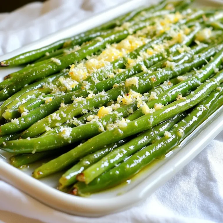 - 1 pound fresh green beans, trimmed - 4 cloves of garlic, minced - 2 tablespoons olive oil - ½ cup grated Parmesan cheese - 1 teaspoon lemon zest - Salt and pepper to taste - 1 teaspoon red pepper flakes (optional) You can swap fresh green beans for other veggies. Try asparagus or broccoli. If you have garlic powder, use it instead of minced garlic. You can also replace olive oil with melted butter for a richer taste. If you lack Parmesan, any hard cheese will work well. Nutritional yeast can replace cheese for a vegan option. One serving of Roasted Garlic Parmesan Green Beans offers great nutrition. Each serving has about 150 calories. It includes 5 grams of protein and 7 grams of fat. The dish is low in carbs, with around 10 grams per serving. Green beans are packed with vitamins and minerals, like vitamin C and fiber. This makes them a healthy choice for any meal. First, gather your ingredients. You will need: - 1 pound fresh green beans, trimmed - 4 cloves of garlic, minced - 2 tablespoons olive oil - ½ cup grated Parmesan cheese - 1 teaspoon lemon zest - Salt and pepper to taste - 1 teaspoon red pepper flakes (optional) Next, preheat your oven to 425°F (220°C). This step is key for a great roast. In a large bowl, combine the trimmed green beans, minced garlic, and olive oil. Toss well until the green beans shine with oil. This mix adds flavor and helps everything roast evenly. Now, spread the green beans out on a baking sheet in a single layer. It’s important that they don’t overlap. Sprinkle salt, pepper, and red pepper flakes over them for some heat if you like. Roast in the oven for 15-20 minutes. Stir the beans halfway through. This helps them cook evenly and get that nice, crisp texture. When they are tender and slightly crispy, take them out. Right away, sprinkle the grated Parmesan cheese and lemon zest over the hot green beans. Toss them together to coat. If you want the cheese to melt a bit, pop them back in the oven for 2-3 minutes. To get the best results, follow these tips: - Use a large baking sheet. A crowded sheet leads to steaming, not roasting. - Spread the beans in one layer. This ensures they cook evenly. - Stir halfway through. This helps all sides of the beans get that nice roast. - Watch the time. Every oven is different, so check them a few minutes early. These steps will help you make perfect roasted garlic Parmesan green beans every time! To get a great roasted garlic taste, use fresh garlic. Mince the garlic just before use. This keeps the flavor strong. Mix the minced garlic with olive oil and green beans. This helps the garlic roast well. Roasting garlic turns it sweet and mild. It adds a rich flavor to the dish. Make sure to spread the garlic evenly so every bite gets that great taste. Crisp green beans are a must. To achieve this, do not overcrowd the baking sheet. Spread the green beans in a single layer. This lets them roast evenly. Roast them at 425°F (220°C) to get that perfect texture. Stir them halfway through cooking. This helps them cook evenly and get crispy. Check them after 15 minutes. They should be tender but still crisp. Lemon zest gives a bright flavor to the green beans. Use a fresh lemon for the best taste. Grate the outer yellow peel, avoiding the white part. The white part can be bitter. Add the zest right after roasting. Toss it with the green beans and cheese. This will brighten the dish and make it pop. You can even add a squeeze of lemon juice for more flavor. {{image_2}} You can switch up the cheese to change the taste. Try using feta cheese for a salty kick. Goat cheese adds creaminess and tang. Cheddar gives a sharp flavor that blends well. Each cheese brings a new twist to this dish. Feel free to mix and match. Green beans taste great on their own, but you can add more veggies. Carrots bring a sweet crunch. Bell peppers add color and flavor. Zucchini is soft and complements the green beans well. Just chop them into similar sizes. Toss them in with the beans to roast together. You can change the spices to create new flavors. For a smoky taste, add smoked paprika. Italian herbs like oregano or basil work well too. If you love heat, try cayenne pepper instead of red pepper flakes. You can even add a squeeze of lime for a zesty touch. To keep your Roasted Garlic Parmesan Green Beans fresh, store them in an airtight container. Make sure they cool down before sealing the container. Place them in the fridge if you plan to eat them within three days. This helps maintain their flavor and crunch. Avoid stacking too many layers in the container, as this can cause sogginess. Reheating your green beans can bring back some of their original taste. For best results, use your oven. Preheat it to 350°F (175°C) and place the green beans on a baking sheet. Heat them for about 10-15 minutes. This helps keep them crisp. If you’re short on time, you can use a microwave. Just heat in short bursts, stirring in between, until warm. If you want to save your green beans for later, freezing is a great option. First, let them cool completely. Spread the green beans on a baking sheet in a single layer. Freeze them for about 2 hours. Once frozen, transfer them to a freezer bag. Make sure to squeeze out as much air as possible before sealing. They can last up to three months in the freezer. When you're ready to enjoy them, simply thaw in the fridge overnight and reheat as needed. Yes, you can use frozen green beans. They work well too. Just thaw them first. Pat them dry to remove excess water. This helps them roast better, keeping them crisp. You know the green beans are done when they are bright green and tender. They should have a slight crunch. Roast them for about 15 to 20 minutes. Stir them halfway to ensure even cooking. Roasted Garlic Parmesan Green Beans pair well with many dishes. Try them with grilled chicken or fish. They also go great with steak or pork chops. Serve them alongside rice or quinoa for a full meal. Roasting green beans with garlic and cheese is simple and fun. We covered key ingredients, like substitutions and nutrition. You learned step-by-step instructions for preparation and cooking. Tips helped you perfect flavor and crispiness. We explored variations with cheeses and veggies. Lastly, we discussed proper storage and reheating. Try these methods and enjoy delicious green beans. Your meals will be brighter and tastier!